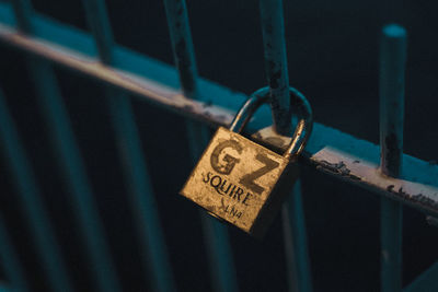 Close-up of padlocks on railing