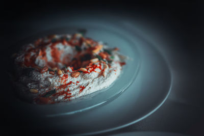 Close-up of hummus in plate on table