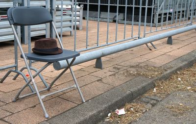 Empty chairs on street