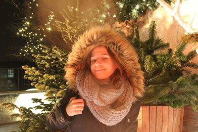 Portrait of smiling woman in snow