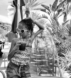 Girl having drink by inflatable ring