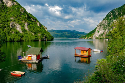 Scenic view of lake and mountains against sky