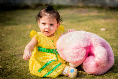 Portrait of cute girl playing with toy