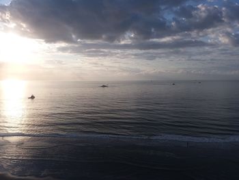 Scenic view of sea against cloudy sky