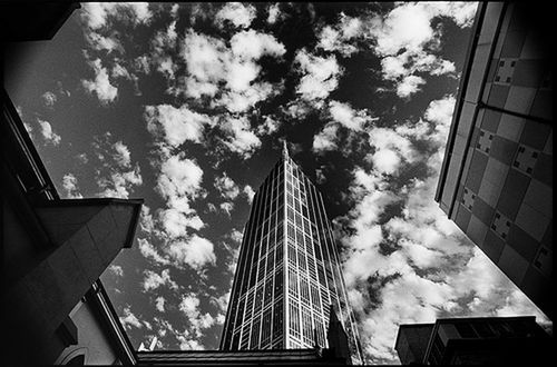 low angle view, architecture, built structure, building exterior, sky, cloud - sky, city, building, modern, office building, skyscraper, tall - high, cloudy, cloud, glass - material, tower, outdoors, directly below, day, residential building