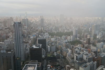 High angle view of buildings in city against sky