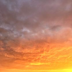 Low angle view of dramatic sky during sunset