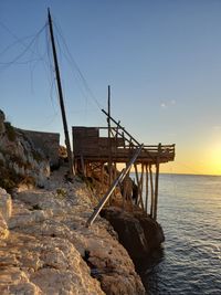 Scenic view of sea against clear sky during sunset