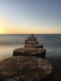 Scenic view of sea against clear sky during sunset