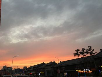 High section of building against sky at sunset