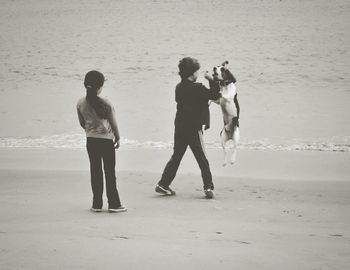 Full length of man standing on beach