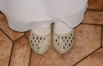 Low section of man standing on floor