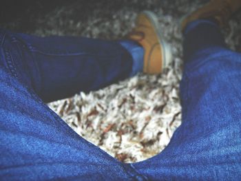 Low section of woman standing on tiled floor