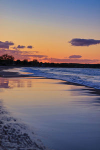 Scenic view of sea against sky at sunset