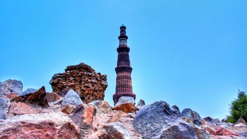 Low angle view of rock formation against blue sky