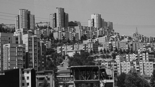 High angle view of buildings in city against sky