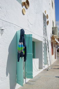 Man working on wall of building