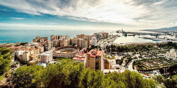 High angle view of plaza de toros de la malagueta against cloudy sky in city