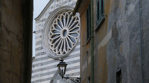 Low angle view of clock on old building