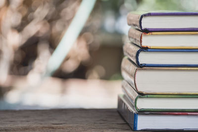 Close-up of books stacked on table