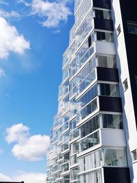 Low angle view of office building against sky