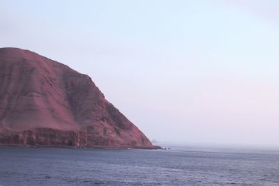 View of sea against mountain