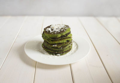 High angle view of pancakes in plate on table