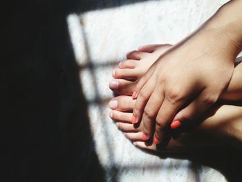 Close-up of woman touching legs 