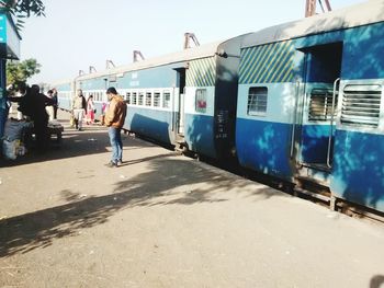 View of people against blue sky