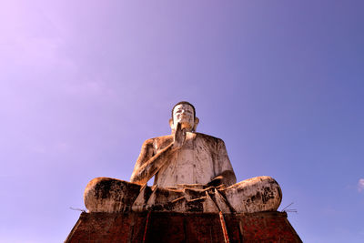 Low angle view of statue against sky