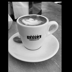 Close-up of coffee cup on table