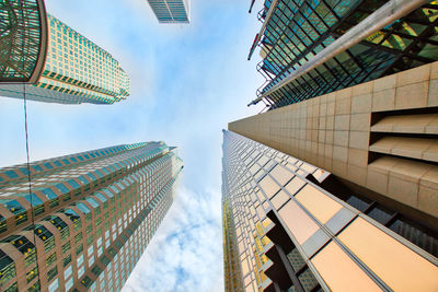 Low angle view of modern buildings against sky