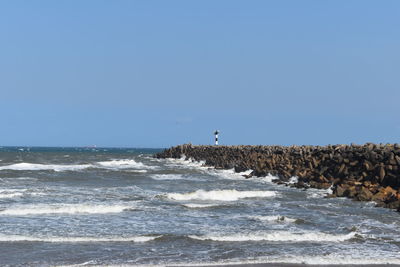 Scenic view of sea against clear blue sky