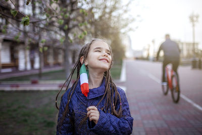 Portrait of smiling woman in city