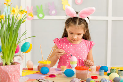 Portrait of boy playing with toys on table