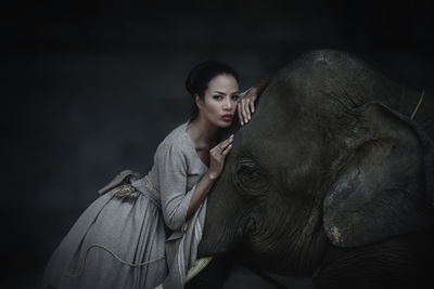 Young woman with elephant