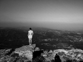 Man standing on rock formation