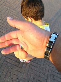 High angle view of boy using mobile phone