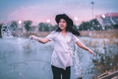 Young woman standing outdoors