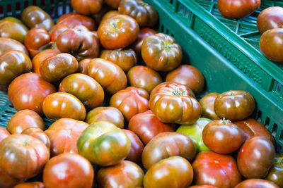 High angle view of tomatoes for sale at market stall