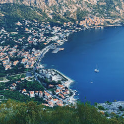 High angle view of townscape by sea
