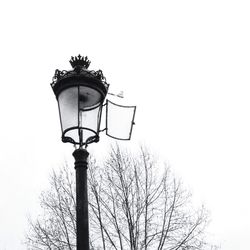 Low angle view of lamp post against sky