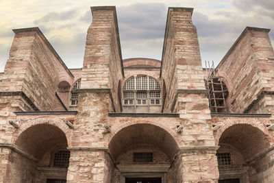 Low angle view of historical building against sky