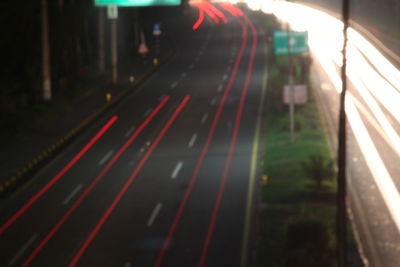 High angle view of light trails on road at night