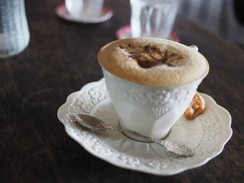 Close-up of cappuccino on table