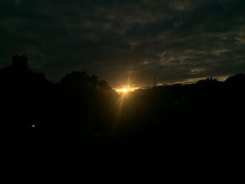 Silhouette of trees against sky at sunset