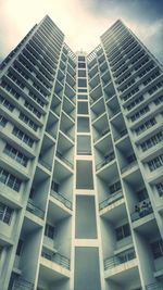 Low angle view of office building against sky