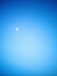 Scenic view of moon against clear blue sky