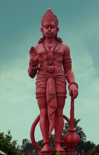 Low angle view of statue against sky