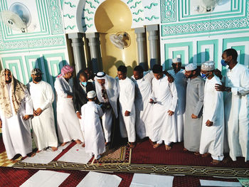 Group of people in front of building